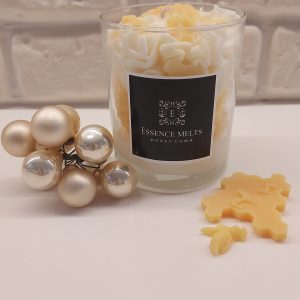 Honeycomb - candle in a glass jar with a whipped white topping, yellow sprinkles, and honeycomb-shaped wax accents, displayed with pearl ornaments. Dessert candles