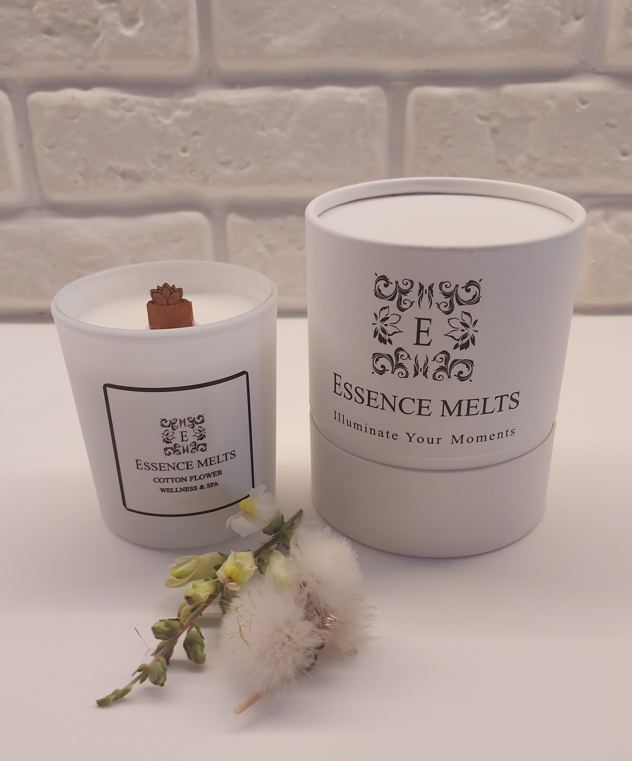 Cotton Flower - Candle in elegant white glass jar on neutral background. Spa Candles