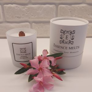 Magnolia Spa Candle in a white frosted glass jar with delicate wax floral details. Spa candles