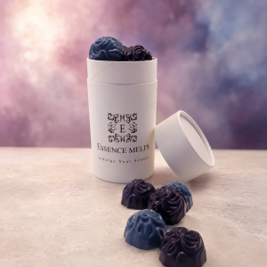 Blackberry and Blueberry scented wax melts in purple and blue with Essence Melts packaging