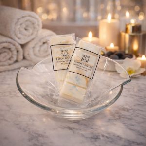 Essence Melts Beauty of the Island handmade soy wax melt bars in luxury spa setting with glass bowl and candlelight