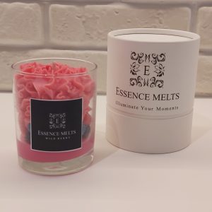 Wild Berry Candle in a clear glass jar with creamy berry-toned wax, topped with realistic wax fruit decorations and styled on a white background.