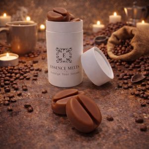 Brazilian Coffee scented wax melts in Essence Melts container styled with roasted coffee beans, espresso cup and warm candlelight background.