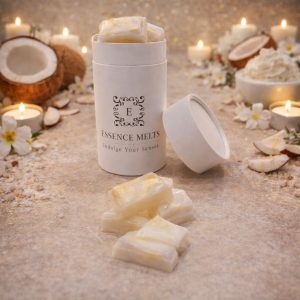 Coconut Cream scented wax melts in Essence Melts container styled with fresh coconut halves, coconut flakes and warm candlelight background.