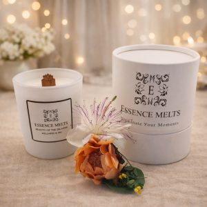 White glass candle labeled Beauty of the Islands- candle on a white surface with soft tropical lighting. Spa candles