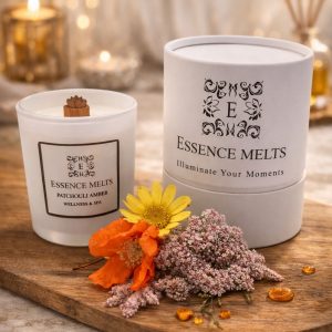 Patchouli Amber scented candle in white glass with cherry wood wick, placed on a stone surface. Spa Candles