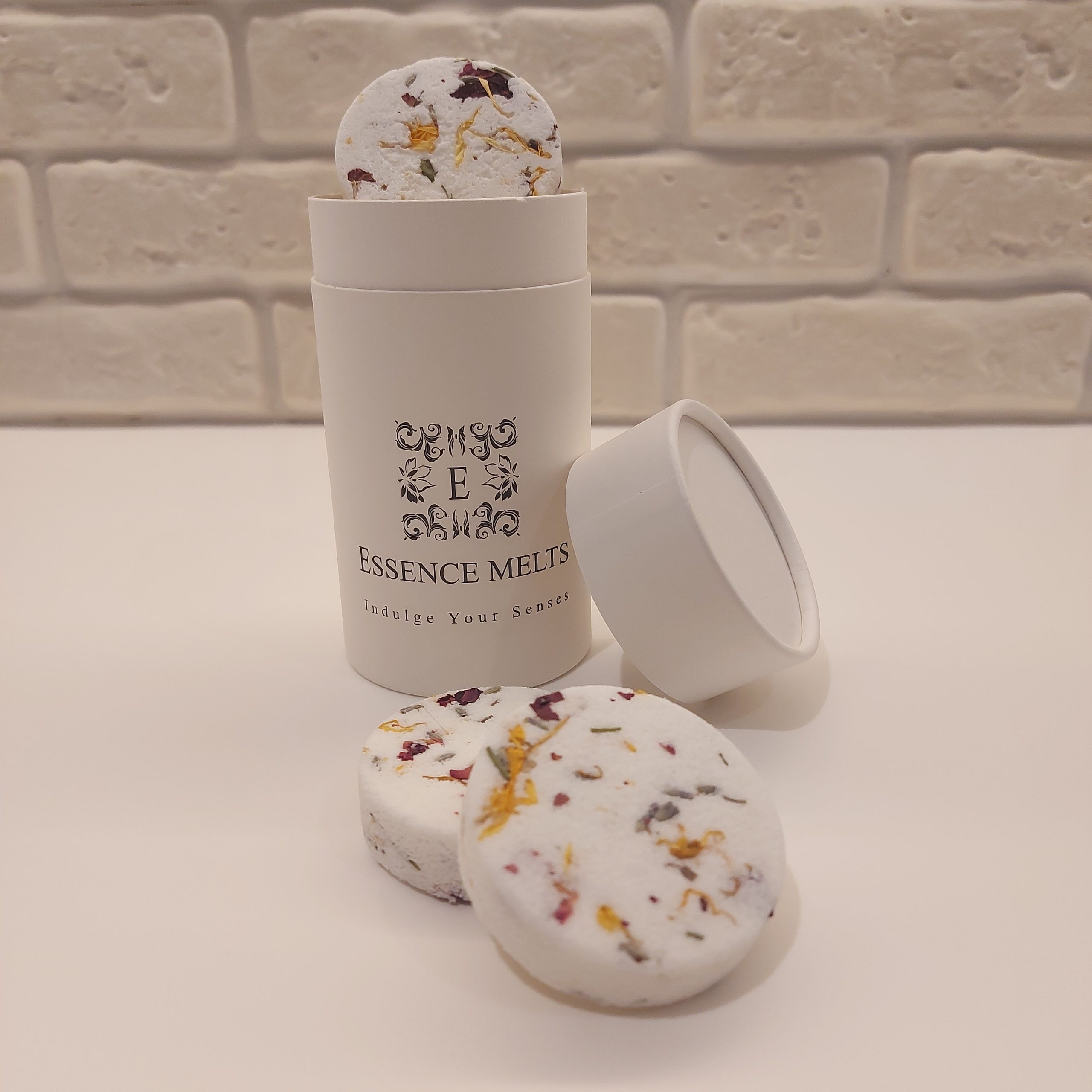 Fruit Floral Bliss Shower Steamers in a white bio degradable tube, with floral and citrus accents