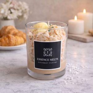 Gourmet Pastry - candle by Essence Melts, featuring a glass jar candle with whipped wax, colorful sprinkles, and pastry-shaped accents, displayed with branded packaging. Dessert candles