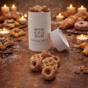 Gourmet Pastry scented wax melts in Essence Melts container styled with croissants, pastries and warm candlelight background.