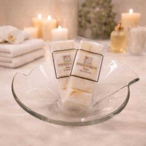 Monoi scented soy wax melt snap bar wrapped in clear cellophane with Essence Melts logo