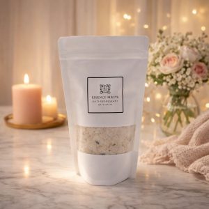 Essence Melts Anti Depressant Bath Salts in white resealable pouch with natural mineral salts and botanicals on elegant cozy background