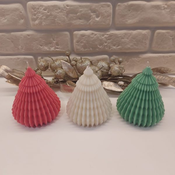 Essence Melts Christmas tree-shaped pillar candle available in red, white, and green soy wax with festive decorative details.
