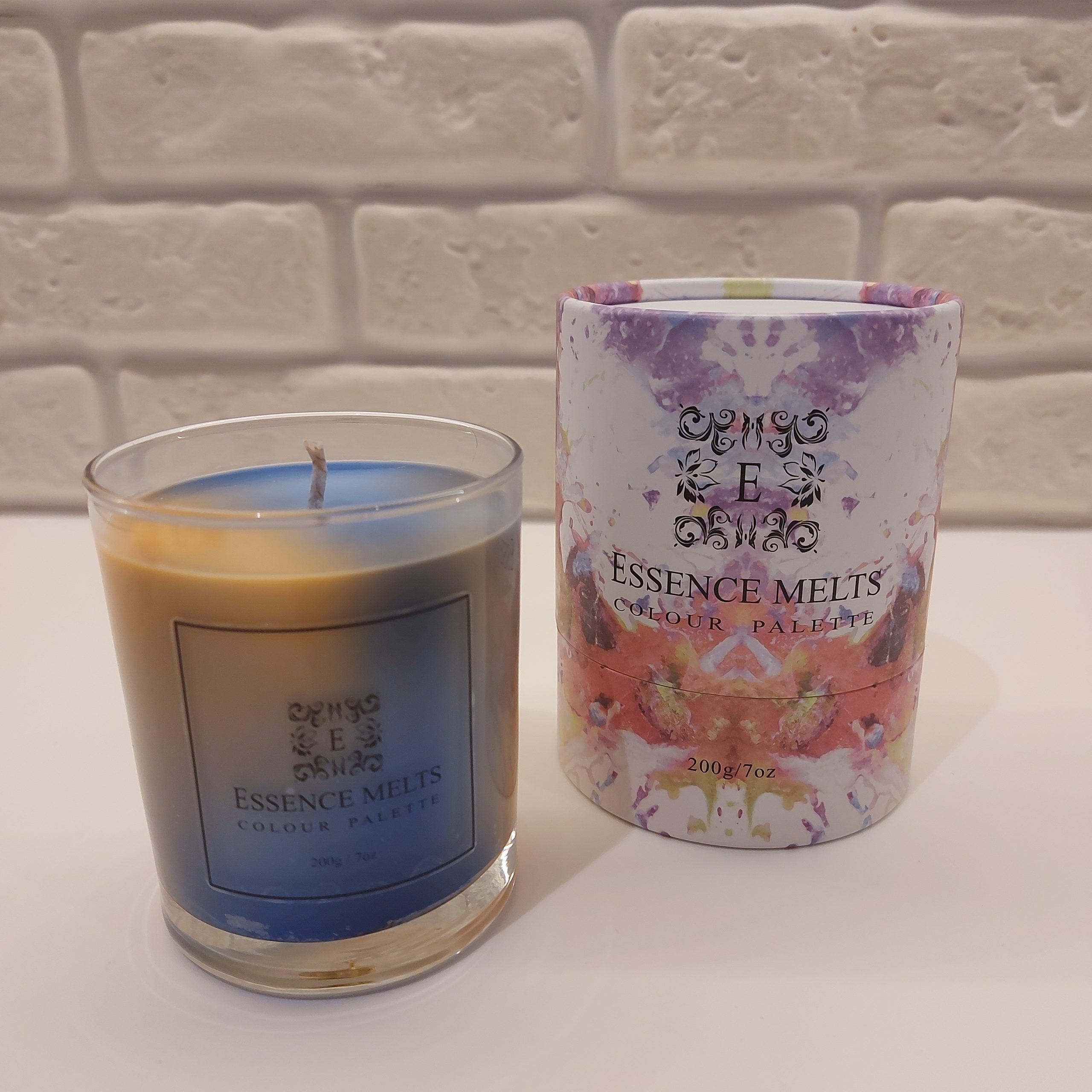 Color Palette N12 – orange and blue marbled candle in a clear glass jar