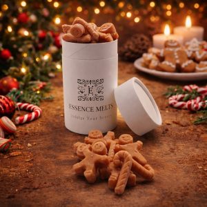 Essence Melts gingerbread candle in a white jar with whipped wax topping and wax gingerbread cookie decorations.