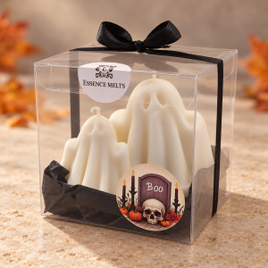 Large and small white ghost candles in a clear gift box with black ribbon, Essence Melts label and Halloween sticker.