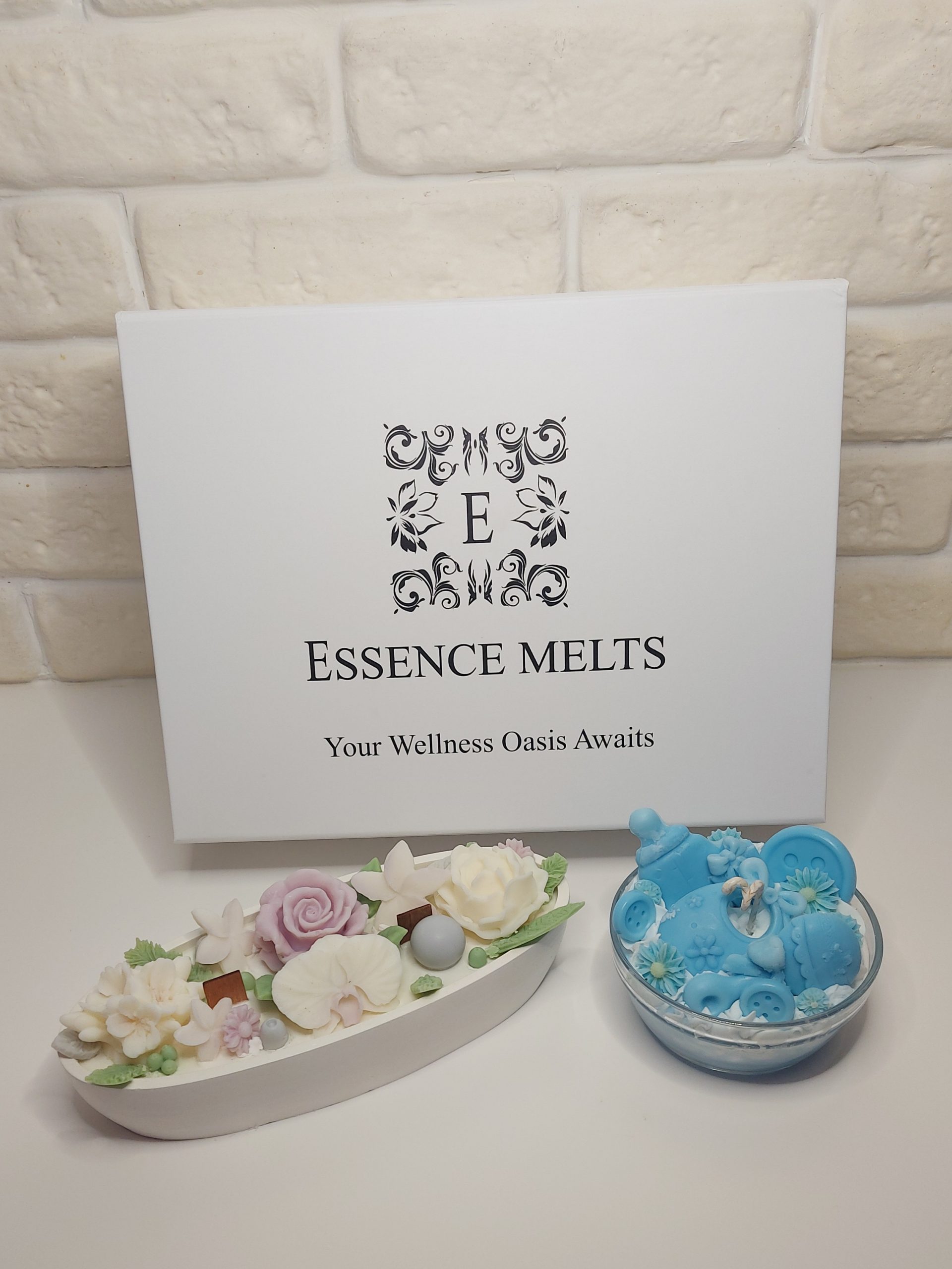 Blue Little Blessing baby boy candle gift box packaging with floral candle and baby-themed candle inside.